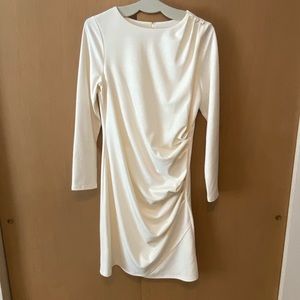 White long sleeved form fitting dress with jeweled shoulder detail